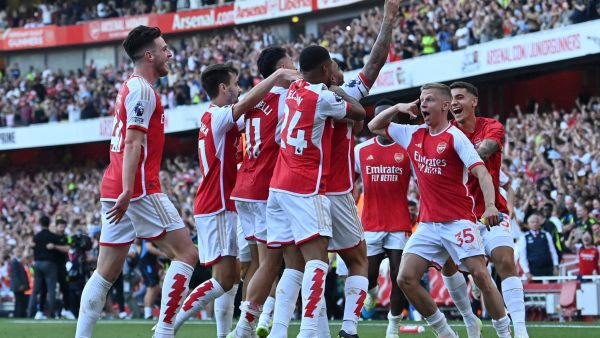 Arsenal's Brazilian striker #09 Gabriel Jesus celebrates with teammates after scoring their third goal during the English Premier League football match between Arsenal and Manchester United at the Emirates Stadium in London on September 3, 2023. (Photo by Glyn KIRK / AFP)