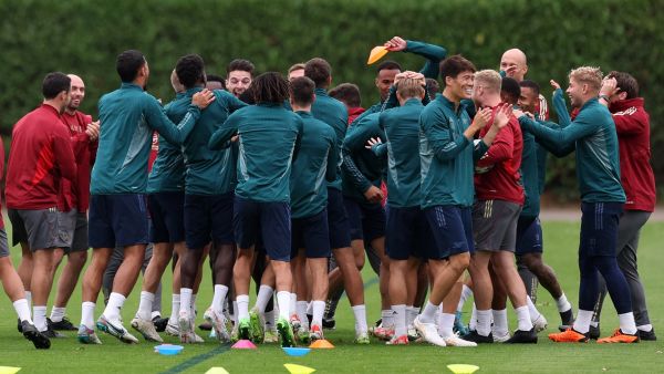 Arsenal's Japanese defender #18 Takehiro Tomiyasu (6R) and teammates attend a team training session at Arsenal's training ground in north London on September 19, 2023, ahead of their UEFA Champions League Group B football match against PSV Eindhoven. (Photo by Adrian DENNIS / AFP)
