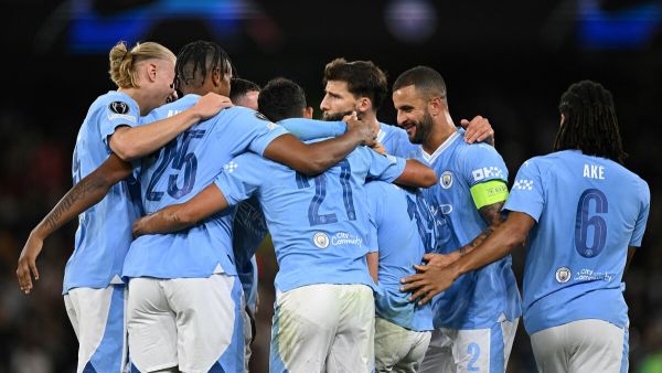Manchester City's Argentinian striker #19 Julian Alvarez celebrates with teammates after scoring his team second goal during the UEFA Champions League Group G football match between Manchester City and FC Crvena Zvezda (Red Star Belgrade) at the Etihad Stadium in Manchester, north west England, on September 19, 2023. (Photo by Oli SCARFF / AFP)