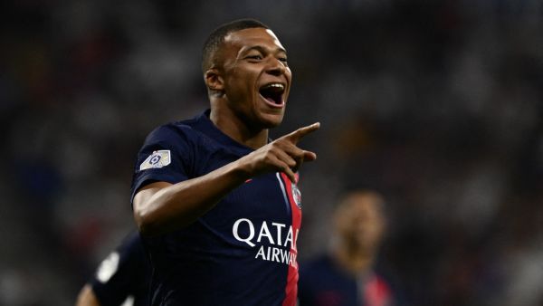Paris Saint-Germain's French forward #07 Kylian Mbappe celebrates after scoring a goal during the French L1 football match between Olympique Lyonnais (OL) and Paris Saint-Germain (PSG) at The Groupama Stadium in Decines-Charpieu, central-eastern France on September 3, 2023. (Photo by Jeff PACHOUD / AFP)