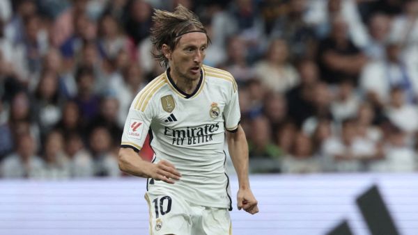 Real Madrid's Croatian midfielder #10 Luka Modric runs with the ball during the Spanish Liga football match between Real Madrid CF and Getafe CF at the Santiago Bernabeu stadium in Madrid on September 2, 2023. (Photo by Thomas COEX / AFP)