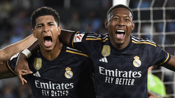 Real Madrid's English midfielder #5 Jude Bellingham (L) celebrates his goal with Real Madrid's Austrian defender #04 David Alaba during the Spanish Liga football match between RC Celta de Vigo and Real Madrid CF at the Balaidos stadium in Vigo on August 25, 2023. (Photo by MIGUEL RIOPA / AFP)
