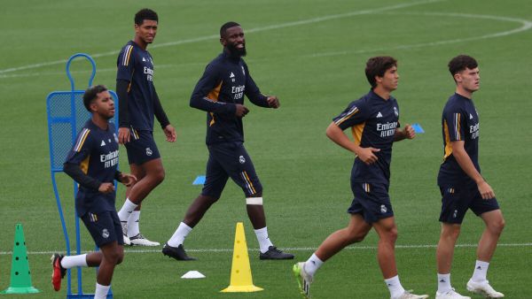 (From L) Real Madrid's Brazilian forward #11 Rodrygo, Real Madrid's English midfielder #5 Jude Bellingham (R) and Real Madrid's German defender #22 Antonio Rudiger attend a training session at Valdebebas Sport City in Madrid on September 16, 2023. (Photo by PIERRE-PHILIPPE MARCOU / AFP)