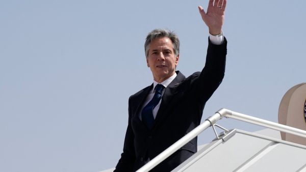 U.S. Secretary of State Antony Blinken waves as he boards a plane leaving Riyadh, Saudi Arabia, on October 15, 2023. Blinken on October 13, 2023, began a tour of six Arab capitals to build pressure on Hamas while Israel readies a massive offensive on the Gaza Strip following the militants' attacks. (Photo by Jacquelyn Martin / AP / AFP) Blinken