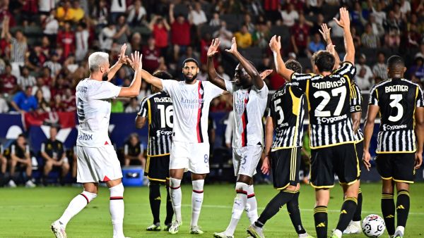 AC Milan's French forward Olivier Giroud (L) celebrates scoring his team's second goal during a pre-season friendly football match between Juventus FC and AC Milan at Dignity Health Sports Park in Carson, California, on July 27, 2023. (Photo by Frederic J. BROWN / AFP)