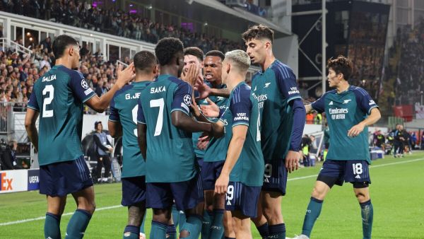 Arsenal's players celebrate after scoring the opening goal during the UEFA Champions League Group B first leg football match between RC Lens and Arsenal FC at the Bollaert Stadium in Lens, northern France, on October 3, 2023. (Photo by DENIS CHARLET / AFP)