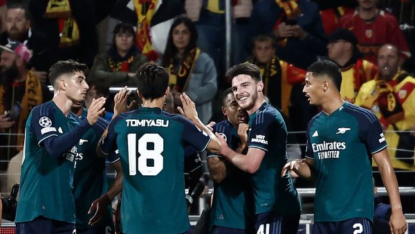 Arsenal's Brazilian striker #09 Gabriel Jesus (C) celebrates with teammates after scoring the opening goal during the UEFA Champions League Group B first leg football match between RC Lens and Arsenal FC at the Bollaert Stadium in Lens, northern France, on October 3, 2023. (Photo by Sameer Al-Doumy / AFP)
