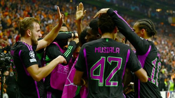 Bayern Munich's English forward #09 Harry Kane (L) celebrates with team mates after scoring a goal during the UEFA Champions League group stage football match between Galatasaray and Bayern Munich at the Ali Sami Yen Spor Kompleksi in Istanbul on October 24, 2023. (Photo by Yasin Akgul / AFP)