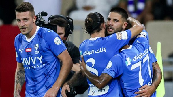Hilal's players celebrate with Serbian forward #09 Aleksandar Mitrovic after he scored a goal during the Saudi Pro League football match between Al-Ittihad and Al-Hilal at Prince Abdullah al-Faisal Stadium in Jeddah on September 1, 2023. (Photo by AFP)