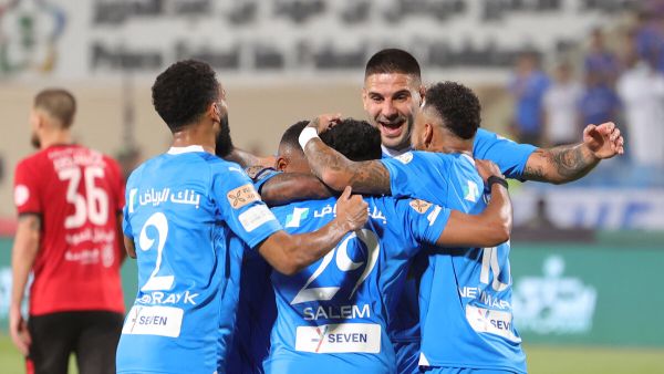 Hilal's players celebrate their team's goal during the Saudi Pro League football match between Al-Hilal and Al-Riyadh at Prince Faisal Bin Fahd Stadium in Riyadh on September 15, 2023. (Photo by Fayez Nureldine / AFP)
