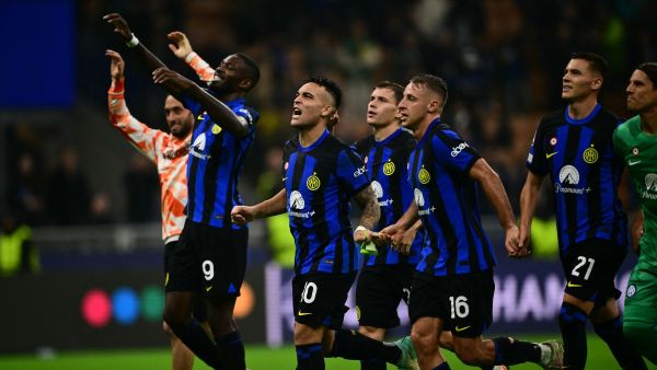 Inter Milan's Argentine forward #10 Lautaro Martinez celebrates with teammates Inter Milan's French forward #09 Marcus Thuram, Inter Milan's Albanian midfielder #21 Kristjan Asllani and Inter Milan's Italian midfielder #16 Davide Frattesi after winning 2-1 the UEFA Champions League 1st round day 3 Group D football match between Inter Milan and Salzburg at the San Siro stadium in Milan on October 24, 2023. (Photo by Marco BERTORELLO / AFP)