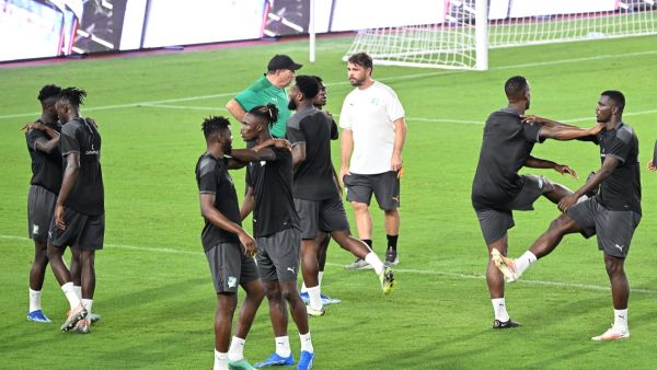 Ivory Coast's players warm up during a training session on the eve of their international friendly football match with Morocco at the Felix Houphouet Boigny Stadium in Abidjan on October 13, 2023. (Photo by Sia KAMBOU / AFP)