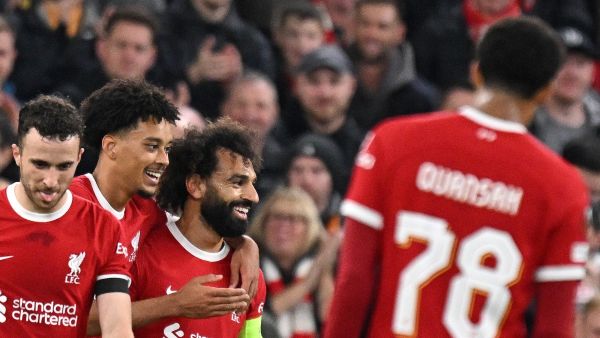 Liverpool's Egyptian striker #11 Mohamed Salah (C) celebrates scoring the team's fifth goal during the UEFA Europa League group E football match between Liverpool and Toulouse at Anfield in Liverpool, north west England on October 26, 2023. Liverpool won the match 5-1. (Photo by Oli SCARFF / AFP)