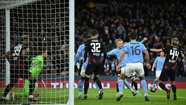 Manchester City's Norwegian striker Erling Haaland (4R) scores the team's fifth goal, his fourth, during the UEFA Champions League round of 16 second-leg football match between Manchester City and RB Leipzig at the Etihad Stadium in Manchester, north west England, on March 14, 2023. (Photo by Oli SCARFF / AFP)