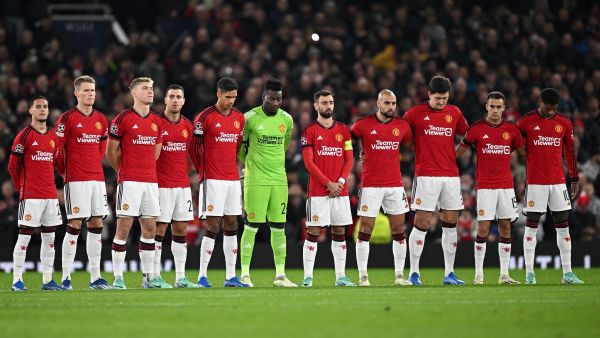 Manchester United's players observe a minute of silence in tribute of late Manchester United player Bobby Charlton who died at the age of 86, last weekend, ahead of the UEFA Champions League Group A football match between Manchester United and FC Copenhagen at Old Trafford, in Manchester, north-west England, on October 24, 2023. (Photo by Paul ELLIS / AFP)
