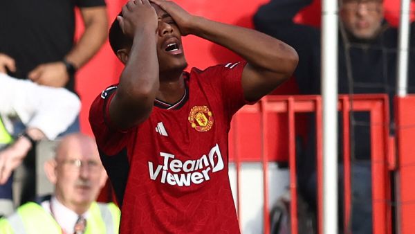 Manchester United's French striker #09 Anthony Martial reacts after missing a late chance during the English Premier League football match between Manchester United and Brentford at Old Trafford in Manchester, north west England, on October 7, 2023. (Photo by Darren Staples / AFP) 