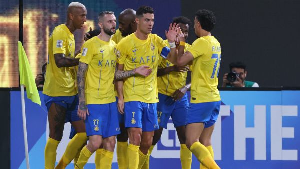 Nassr's Portuguese forward #07 Cristiano Ronaldo celebrates with teammates after their third goal during the AFC Champions League group E football match between Saudi al-Nassr SC and Tajikistan's FC Istiklol at King Saud University Stadium in Riyadh on October 2, 2023. (Photo by Fayez NURELDINE / AFP)