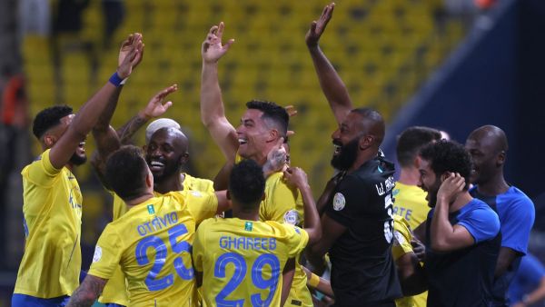 Nassr's Portuguese forward #07 Cristiano Ronaldo (C) celebrates with teammates after scoring their second goal during the Saudi Pro League football match between Al-Nassr and Damac at the King Saud University Stadium in Riyadh on October 21, 2023. (Photo by Fayez NURELDINE / AFP)