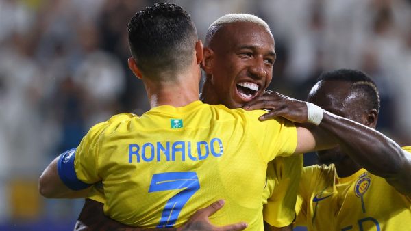 Nassr's Brazilian forward #94 Talisca (C) celebrates after scoring a goal with teammates Nassr's Portuguese forward #07 Cristiano Ronaldo and Nassr's Senegalese Forward #10 Sadio Mane (R) during the AFC Champions League Group E football match between Saudi's al-Nassr and Qatar’s al-Duhail at the King Saud University Stadium in Riyadh on October 24, 2023. (Photo by Fayez NURELDINE / AFP)