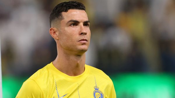 Nassr's Portuguese forward #07 Cristiano Ronaldo stands in line for the national anthems ahead of the Saudi Pro League football match between Al-Nassr and Abha at the King Saud University Stadium in Riyadh on October 6, 2023. (Photo by Fayez NURELDINE / AFP)