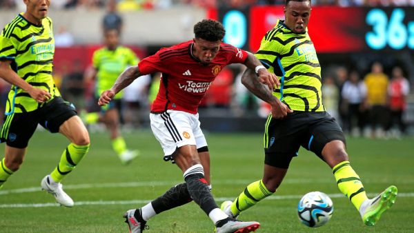 Manchester United's English midfielder Jadon Sancho (C) shoots the ball to score his team's first goal during the friendly football match between Manchester United and Arsenal at MetLife Stadium in East Rutherford, New Jersey, on July 22, 2023. (Photo by Leonardo Munoz / AFP)