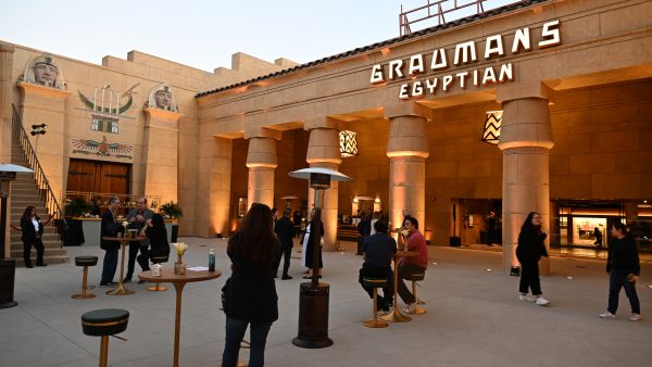 Visitors attend the press preview for the reopening of the Egyptian Theatre, in Hollywood, California