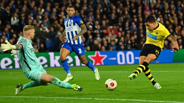 AEK's Argentinian forward #14 Ezequiel Ponce shoots and scores his team third goal during the UEFA Europa League Group B football match between Brighton and Hove Albion and AEK Athens at the American Express Community Stadium in Brighton, southern England on September 21, 2023. (Photo by Glyn KIRK / AFP)