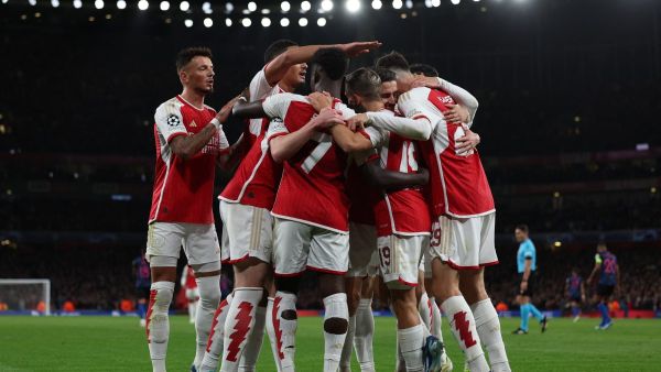 Arsenal's players celebrate their opening goal during the UEFA Champions League Group B football match between Arsenal and Sevilla at the Emirates Stadium in north London on November 8, 2023. (Photo by Adrian DENNIS / AFP)