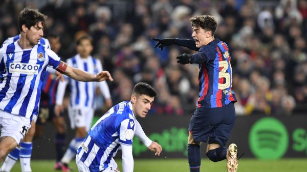 Barcelona's Spanish midfielder Gavi (R) reacts during the Copa del Rey (King's Cup), quarter final football match between FC Barcelona and Real Sociedad, at the Camp Nou stadium in Barcelona on January 25, 2023. (Photo by Pau BARRENA / AFP)