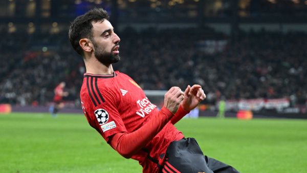 Manchester United's Portuguese midfielder #08 Bruno Fernandes celebrates after scoring the 2-3 from a penalty kick during the UEFA Champions League Group A football match between FC Copenhagen and Manchester United FC in Copenhagen, Denmark on November 8, 2023. (Photo by Jonathan NACKSTRAND / AFP)