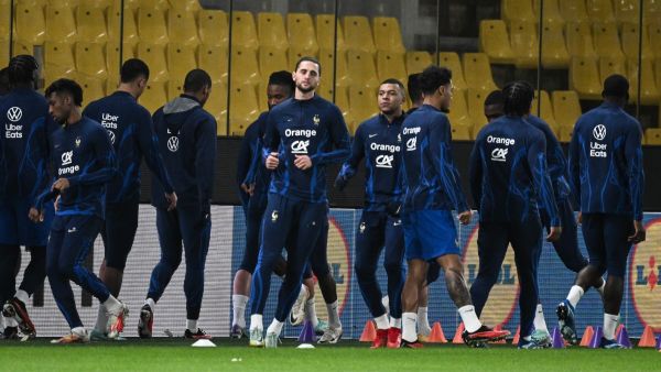 France's midfielder Adrien Rabiot (L), forward Kylian Mbappe (R) and team mates take part in a training session at the Agia Sophia Stadium in Athens on November 20, 2023, on the eve of the UEFA Euro 2024 group B qualifying football match between Greece and France. (Photo by Angelos Tzortzinis / AFP)