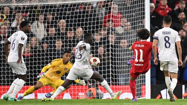 Liverpool's Egyptian striker #11 Mohamed Salah (2R) scores the team's fifth goal during the UEFA Europa League group E football match between Liverpool and Toulouse at Anfield in Liverpool, north west England on October 26, 2023. Liverpool won the match 5-1. (Photo by Oli SCARFF / AFP)