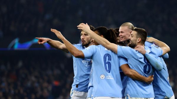 Manchester City's Norwegian striker #09 Erling Haaland (2R) celebrates scoring his team's third goal during the UEFA Champions League Group B second leg football match between Manchester City and Young Boys at the Etihad Stadium in Manchester, north west England, on November 7, 2023. (Photo by Darren Staples / AFP)