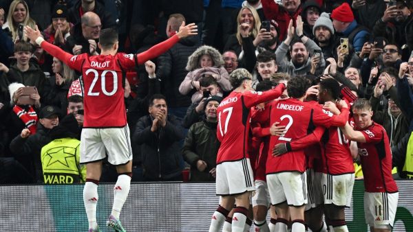 Manchester United's English defender #05 Harry Maguire (unseen) celebrates with teammates after scoring his team first goal during the UEFA Champions League Group A football match between Manchester United and FC Copenhagen at Old Trafford, in Manchester, north-west England, on October 24, 2023. (Photo by Paul ELLIS / AFP)