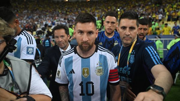 Argentina's forward Lionel Messi leaves the field due to incidents in the stands before the start of the 2026 FIFA World Cup South American qualification football match between Brazil and Argentina at Maracana Stadium in Rio de Janeiro, Brazil, on November 21, 2023. (Photo by CARL DE SOUZA / AFP)