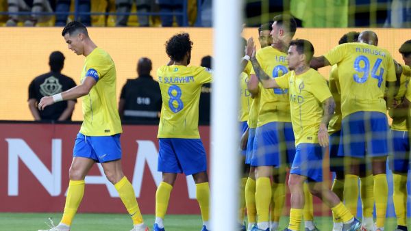 Nassr's Portuguese forward #07 Cristiano Ronaldo and teammates celebrate after he scored a goal during the AFC Champions League Group E football match between Saudi's al-Nassr and Qatar’s al-Duhail at the King Saud University Stadium in Riyadh on October 24, 2023. (Photo by Fayez NURELDINE / AFP)