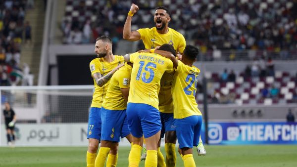 Nassr's players celebrate a goal during the AFC Champions League Group E football match between Qatar's al-Duhail and Saudi’s al-Nassr at the Khalifa International Stadium in Doha on November 7, 2023. (Photo by Karim JAAFAR / AFP)