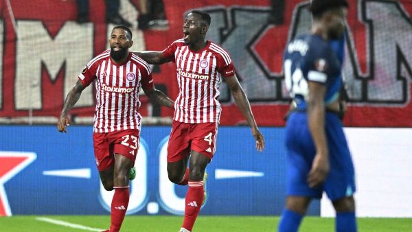 Olympiacos' Brazilian defender #23 Rodinei (L) and Olympiacos' Guinean midfielder #04 Mady Camara (R) celebrate after an own goal by West Ham United's Italian defender #21 Angelo Ogbonna during the UEFA Europa League 1st round day 3 Group A football match between Olympiacos (GRE) and West Ham (ENG) at the Georgios Karaiskakis Stadium in Piraus on October 26, 2023. (Photo by Yorgos Mantheos / Eurokinissi / AFP) / GREECE OUT