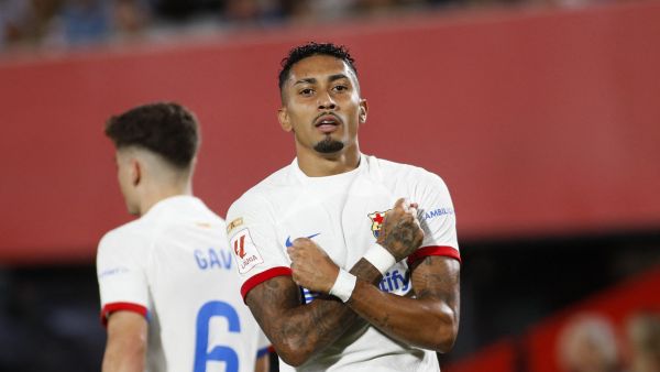 Barcelona's Brazilian forward #11 Raphinha celebrates after scoring his team's first goal during the Spanish Liga football match between RCD Mallorca and FC Barcelona at the Mallorca Son Moix stadium in Palma de Mallorca on September 26, 2023. (Photo by JAIME REINA / AFP)