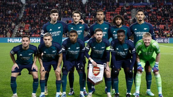 Arsenal's team players pose for a photograph ahead of a UEFA Champions League group B football match between PSV Eindhoven and Arsenal FC at the Philips Stadium in Eindhoven, on December 12, 2023. (Photo by KENZO TRIBOUILLARD / AFP)