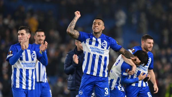 Brighton's Brazilian defender #03 Igor Julio (C) and teammates celebrate on the final whistle in the UEFA Europa League Group B football match between Brighton and Hove Albion and Marseille at the American Express Community Stadium in Brighton, southern England on December 14, 2023. Brighton won the game 1-0 and top the Group. (Photo by Glyn KIRK / AFP)