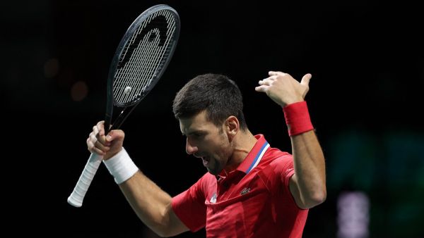 Serbia's Novak Djokovic reacts during the men's doubles semifinal tennis match between Italy and Serbia of the Davis Cup tennis tournament at the Martin Carpena sportshall, in Malaga on November 25, 2023. (Photo by LLUIS GENE / AFP)