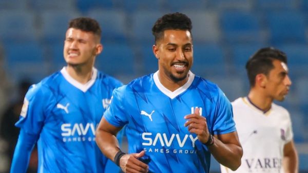 Hilal's Saudi midfielder #29 Salem al-Dawsari (C) celebrates his goal during the AFC Champions League Group D football match between Iran’s Nassaji Mazandaran and Saudi Arabia’s Al-Hilal at Prince Faisal Bin Fahd Stadium in Riyadh on December 4, 2023. (Photo by Fayez NURELDINE / AFP)