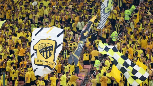 Ittihad fans cheer ahead of the AFC Champions League Group C football match between Saudi's Al-Ittihad and Iraq's Al-Quwa Al-Jawiya at the King Abdullah Sports City in Jeddah on October 23, 2023. (Photo by AFP)