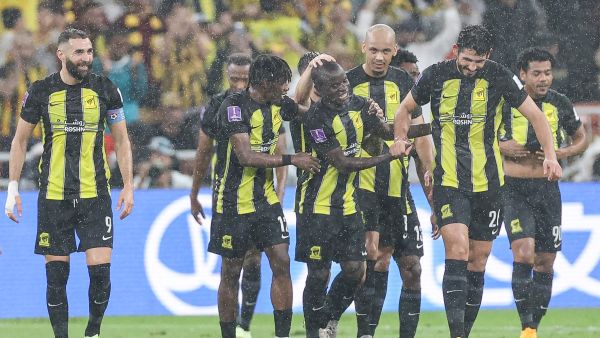 Ittihad's French forward #09 Karim Benzema (L) and Ittihad's French midfielder #07 N'Golo Kante (C) celebrate after a goal during the FIFA Club World Cup first round football match between Al-Ittihad and Auckland City at the King Abdullah Sports City stadium in Jeddah, on December 12, 2023. Al Ittihad secured progress from the first round of the Club World Cup with a convincing 3-0 win against Auckland City. (Photo by AFP)