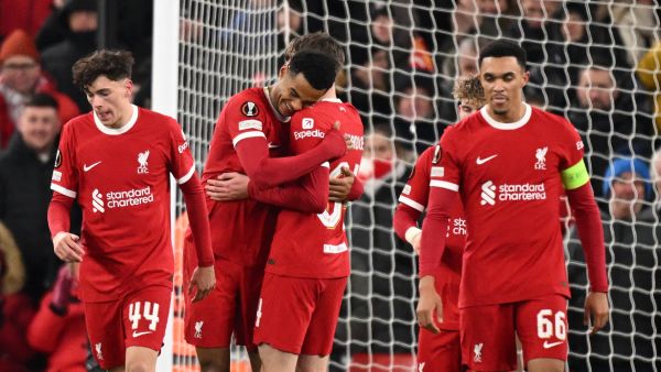 Liverpool's Dutch striker #18 Cody Gakpo (2L) celebrates with teammates after scoring their fourth goal during the UEFA Europa League group E football match between Liverpool and Linzer ASK at Anfield in Liverpool, north west England on November 30, 2023. Liverpool won the game 4-0. (Photo by Oli SCARFF / AFP)