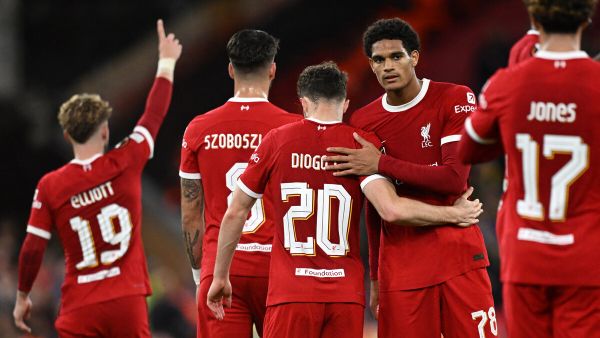 Liverpool's Portuguese striker #20 Diogo Jota (C) celebrates with teammates after scoring their second goal during the UEFA Europa League group E football match between Liverpool and Royale Union Saint-Gilloise at Anfield in Liverpool, north west England on October 5, 2023. Liverpool won the game 2-0. (Photo by Oli SCARFF / AFP)
