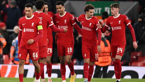 Liverpool's Dutch striker #18 Cody Gakpo (C) celebrates with teammates after scoring their fourth goal during the UEFA Europa League group E football match between Liverpool and Linzer ASK at Anfield in Liverpool, north west England on November 30, 2023. Liverpool won the game 4-0. (Photo by Oli SCARFF / AFP)