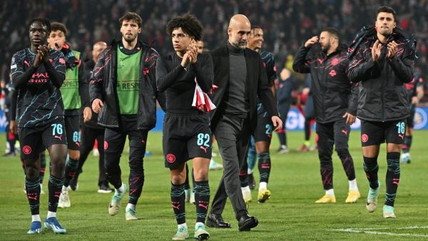 Manchester City's Spanish manager Pep Guardiola (Centre R) and Manchester City players celebrate after winning the UEFA Champions League Group G day 6 group stage football match between Crvena Zvezda (Red Star Belgrade) and Manchester City at the Red Star stadium in Belgrade, on December 13, 2023. (Photo by ANDREJ ISAKOVIC / AFP)