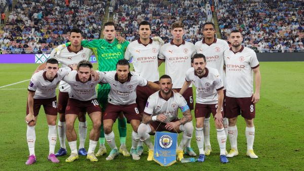 Manchester City players pose for a photo before the start of the FIFA Club World Cup football semi-final match between England's Manchester City and Japan's Urawa Red Diamonds at King Abdullah Sports City in Jeddah on December 19, 2023. (Photo by Giuseppe CACACE / AFP)